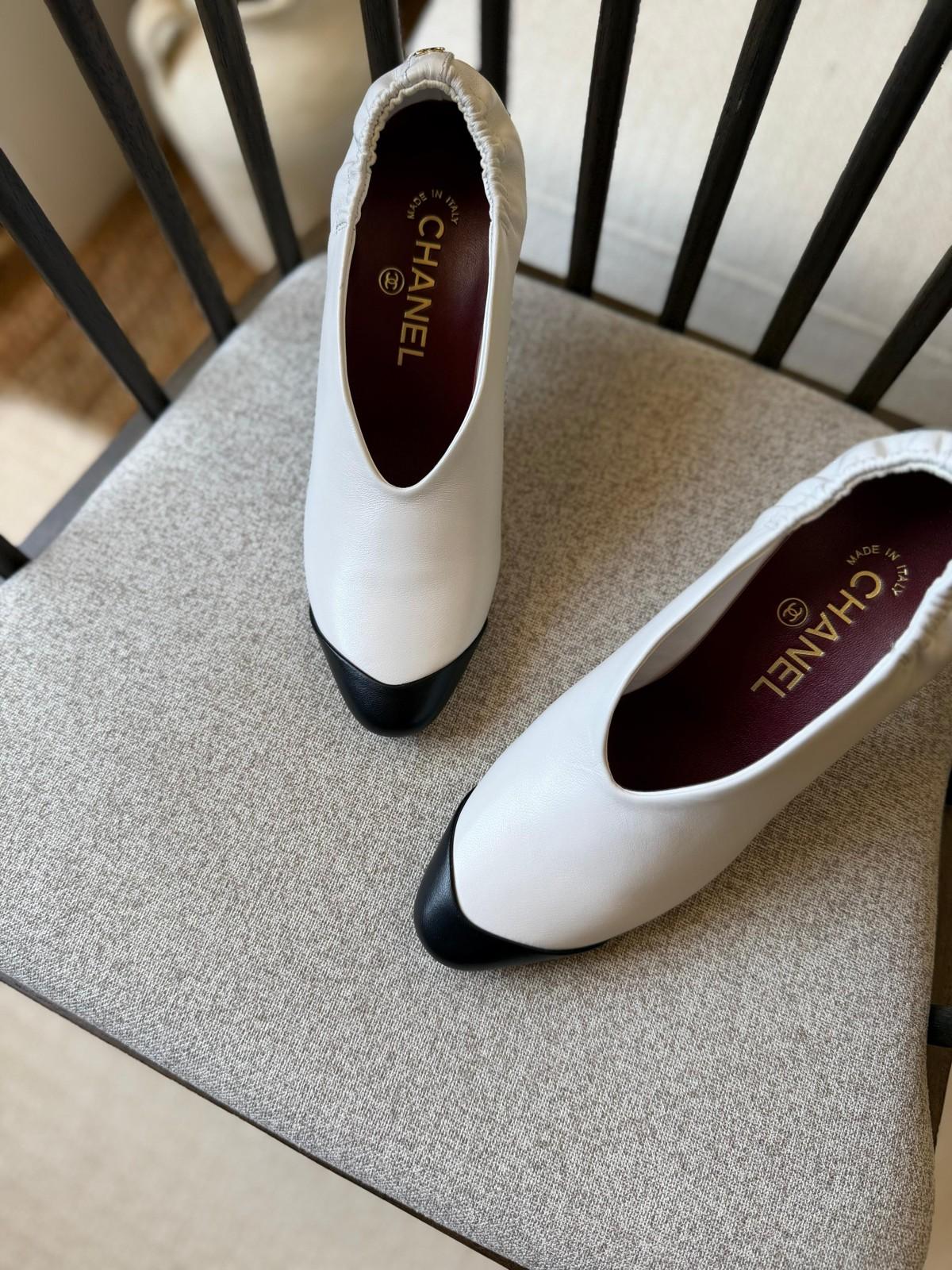 Chanel Pointed Toe Flats in White Leather with Black Cap Toe · 2