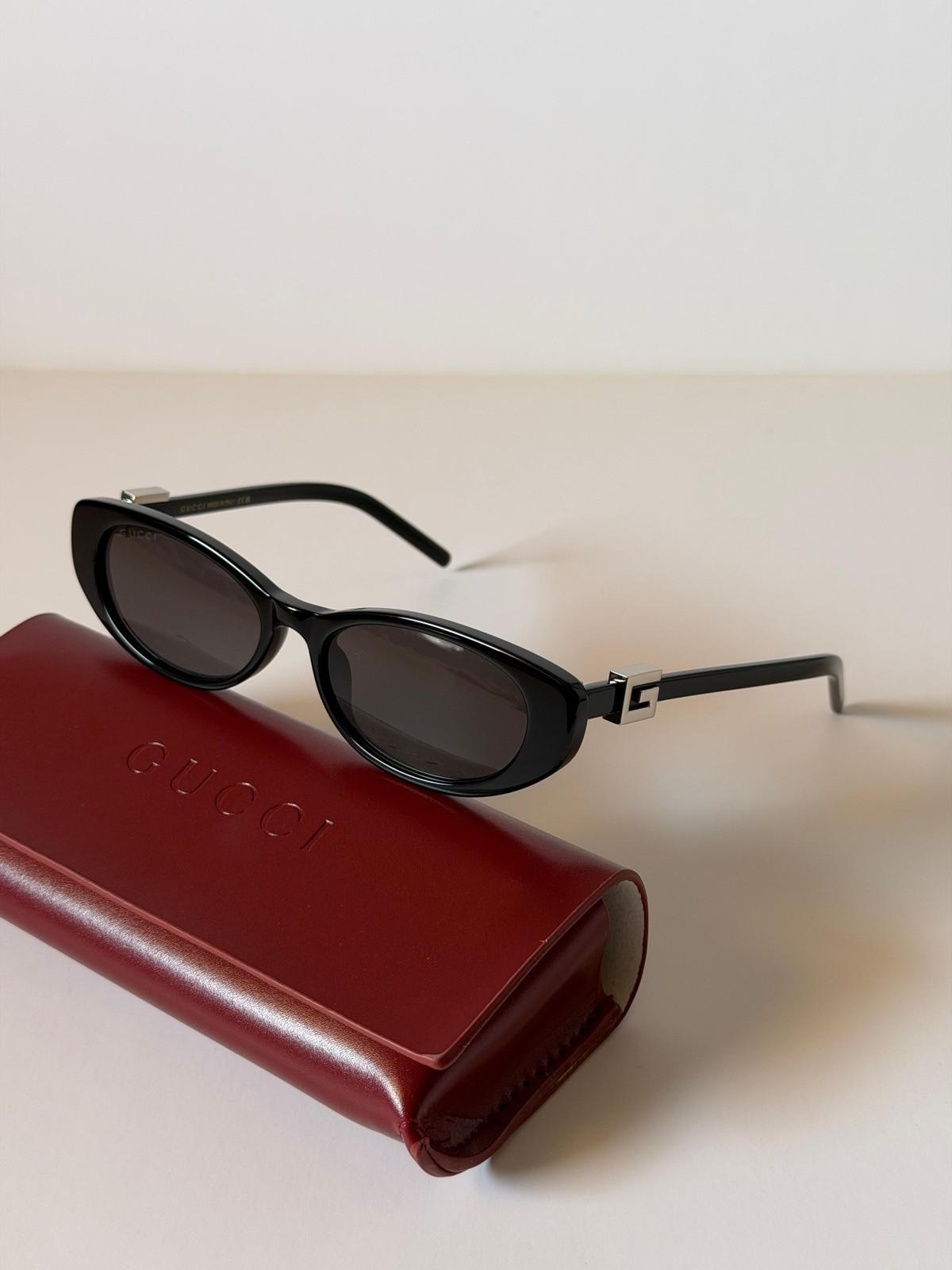 Gucci oval acetate sunglasses with G logo temples · 2