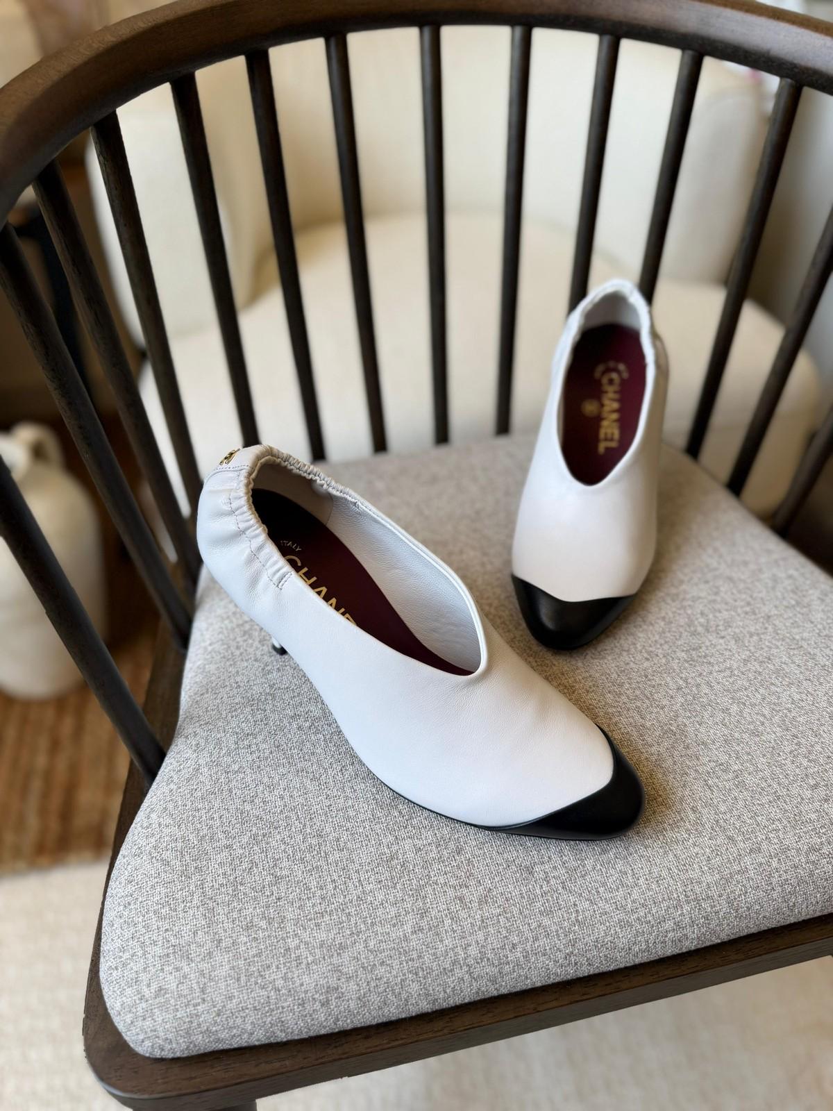 Chanel Pointed Toe Flats in White Leather with Black Cap Toe · 3