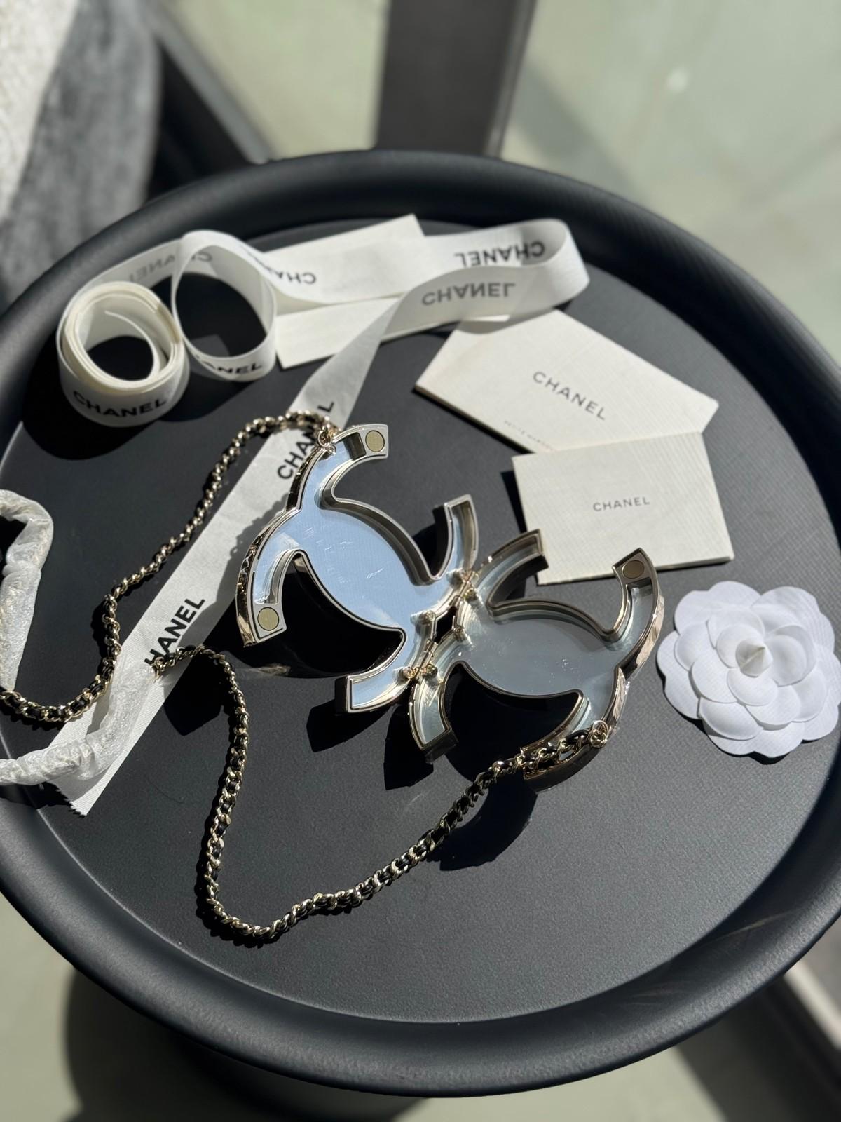 Chanel interlocking CC pendant necklace on a leather-and-chain cord · 3