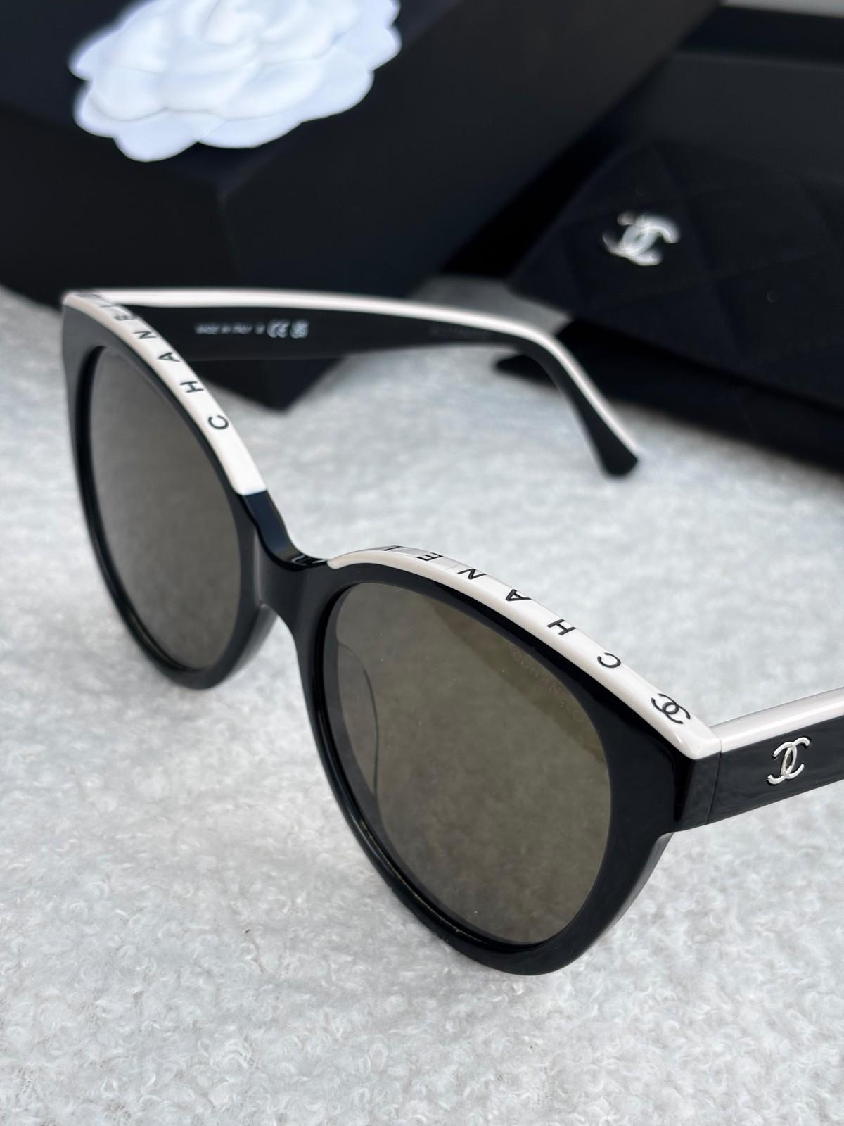 Chanel black acetate sunglasses with CHANEL lettering band · 2