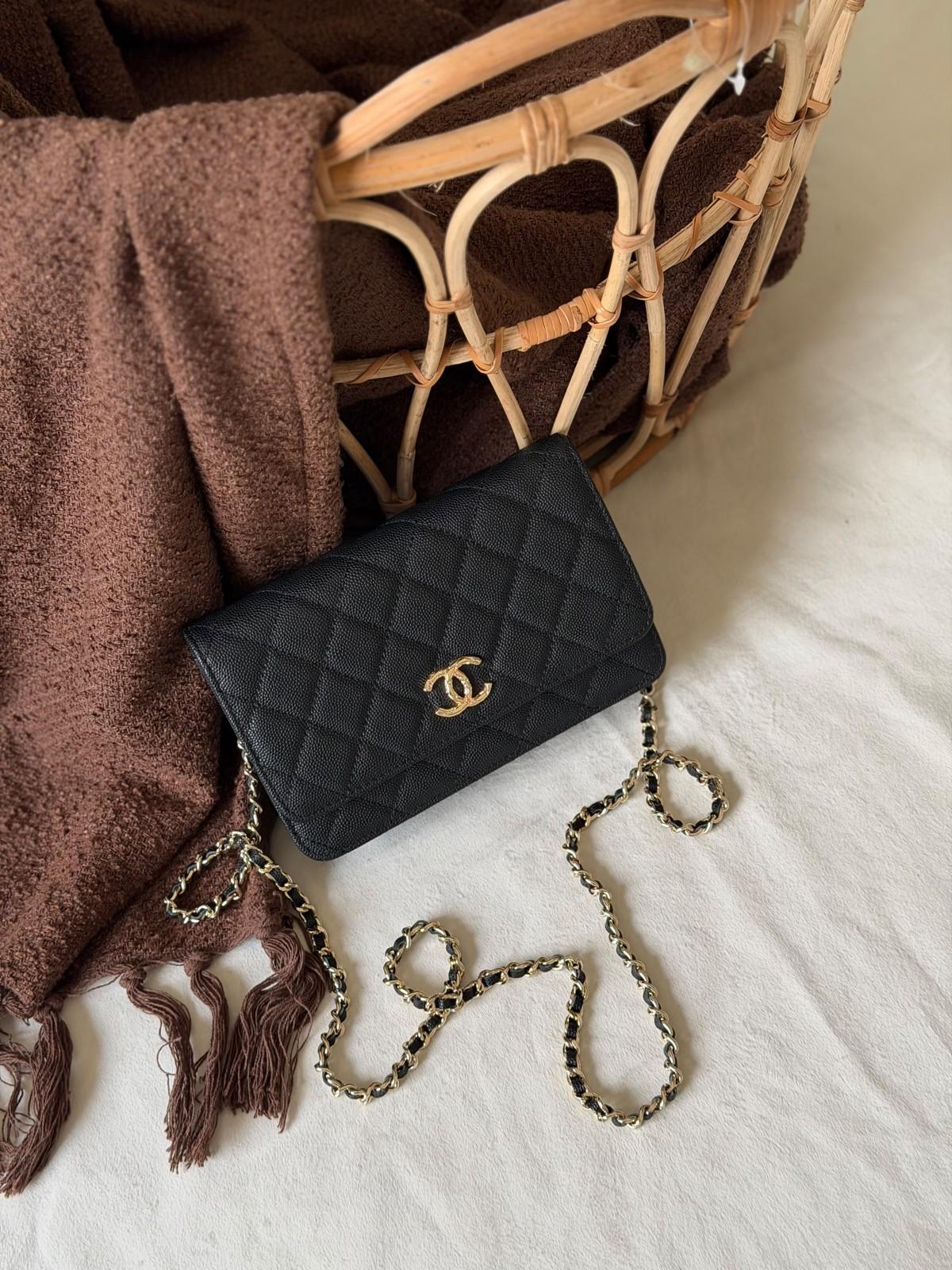 Chanel Wallet on Chain in black caviar calfskin with a CC charm chain · 2