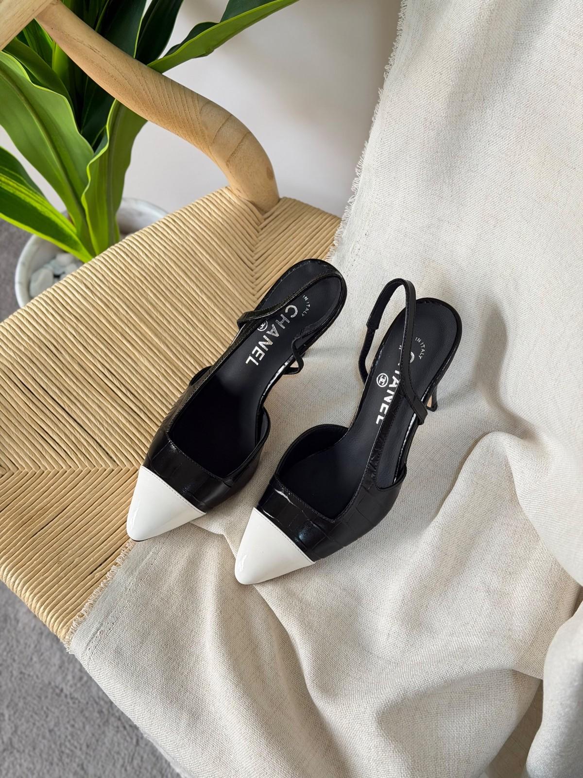 Chanel black slingback pumps with white cap toe · 2