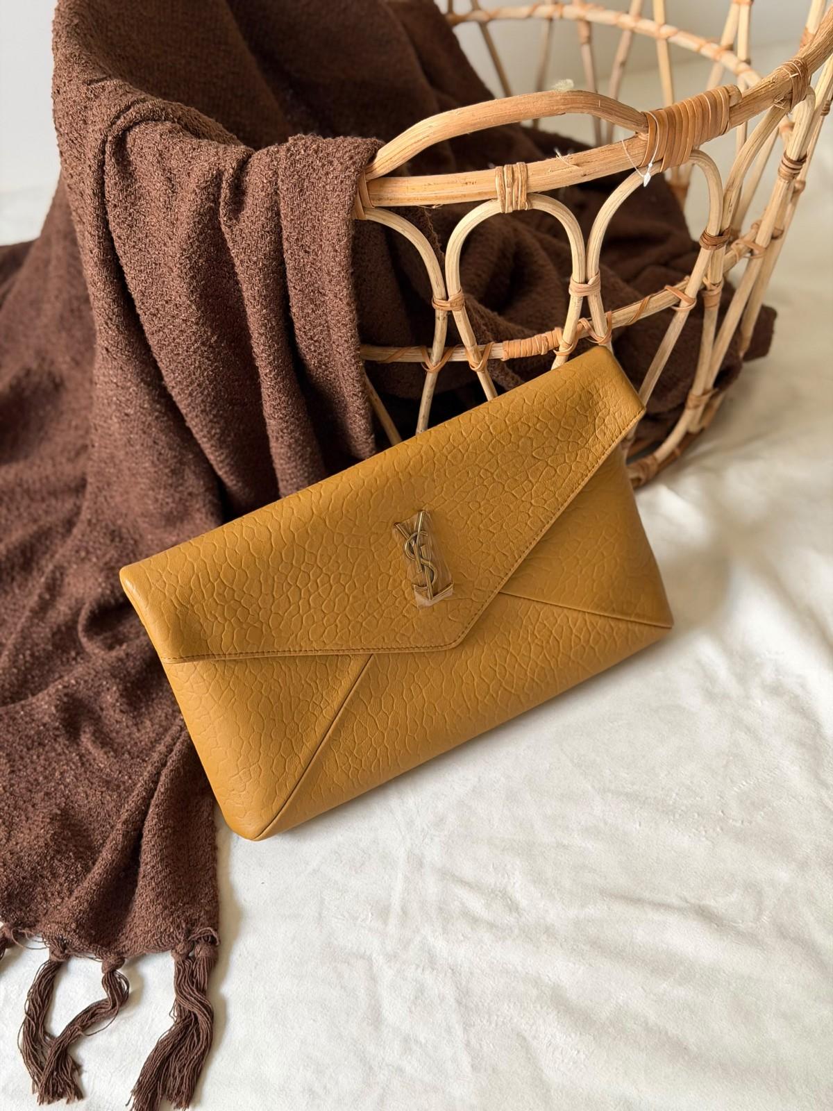Saint Laurent Cassandre large envelope clutch in grained leather · 3