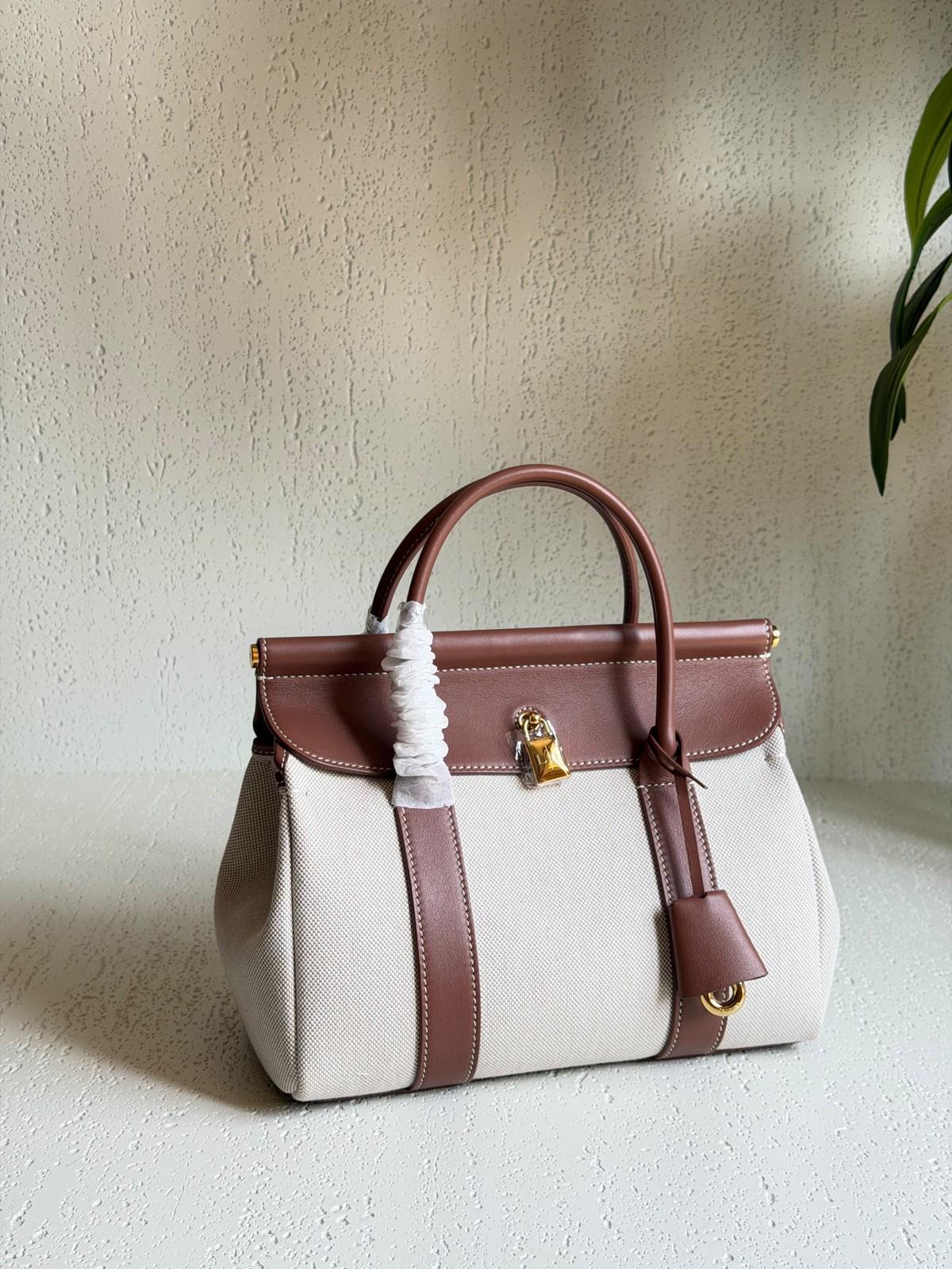 Top-Handle Flap Bag in Pebbled Leather with Lock · 2