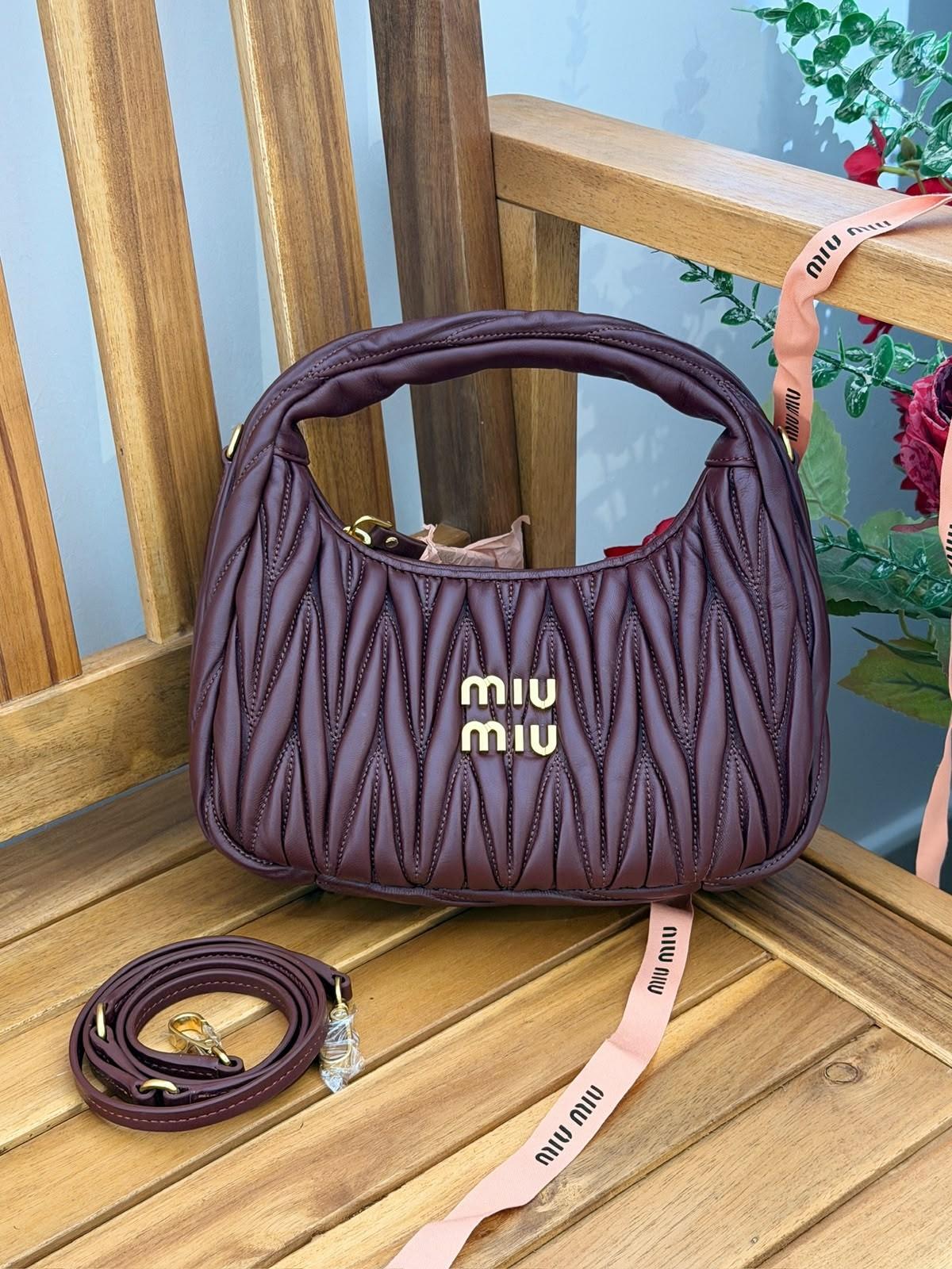 Miu Miu Wander matelassé nappa leather hobo bag with miu miu lettering · 2