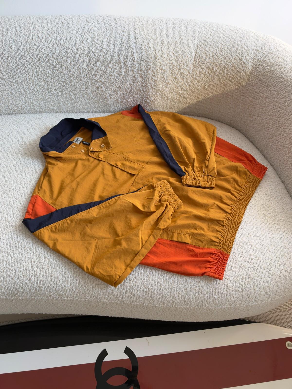 Colour-Block Nylon Pullover Jacket in Mustard Yellow with Orange and Navy Panels · 3