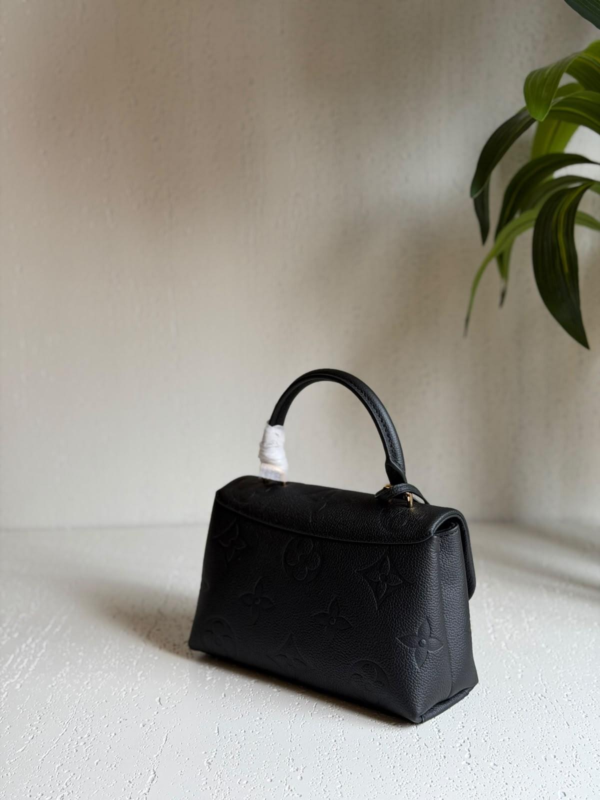 Louis Vuitton Madeleine MM Handbag in Black Monogram Empreinte Leather · 2