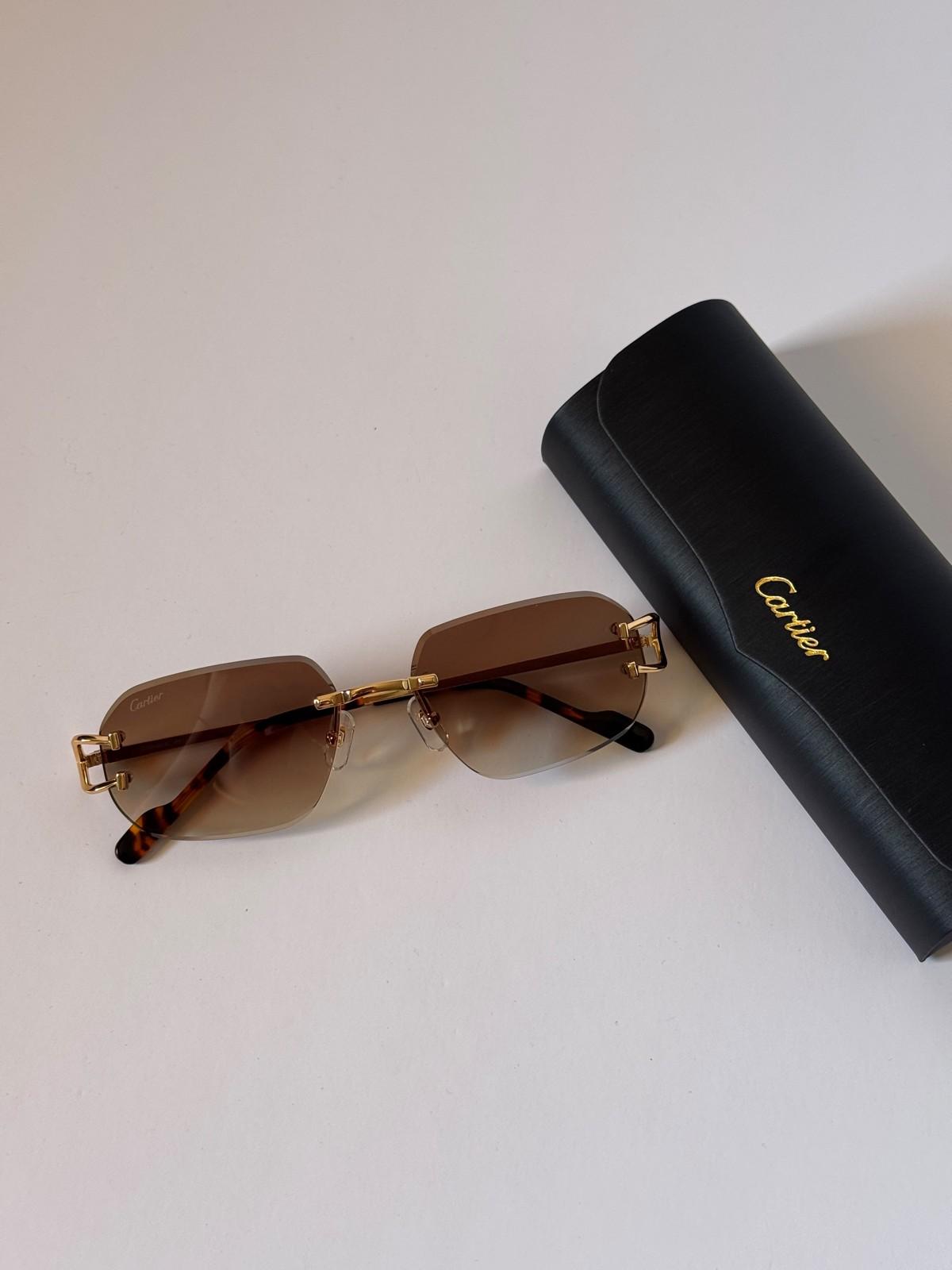 Cartier rimless gold sunglasses with C hinge and tortoiseshell tips · 2
