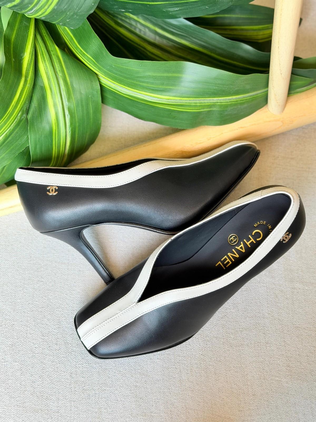 Chanel Slingback Pumps in Black Leather with White Trim · 3