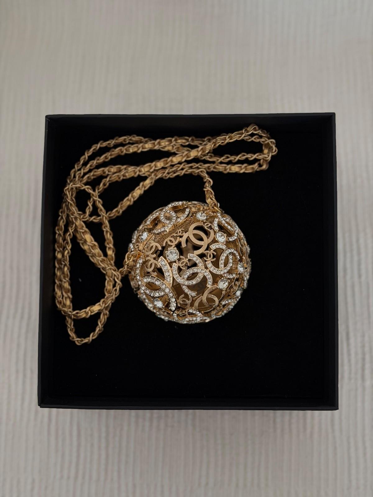 Chanel gold-tone CC sphere pendant necklace set with crystals · 2
