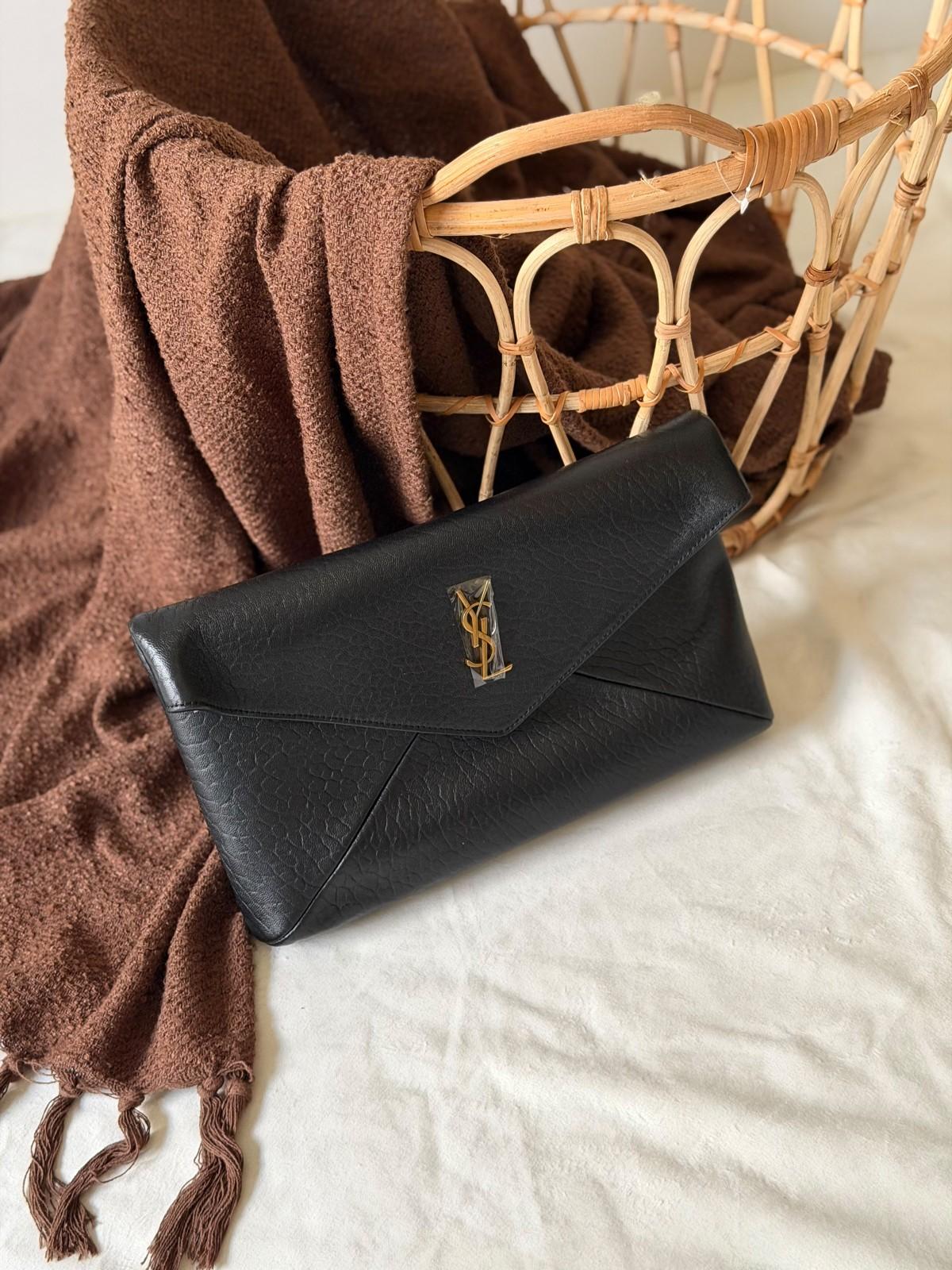 Saint Laurent Cassandre large envelope clutch in grained leather · 2
