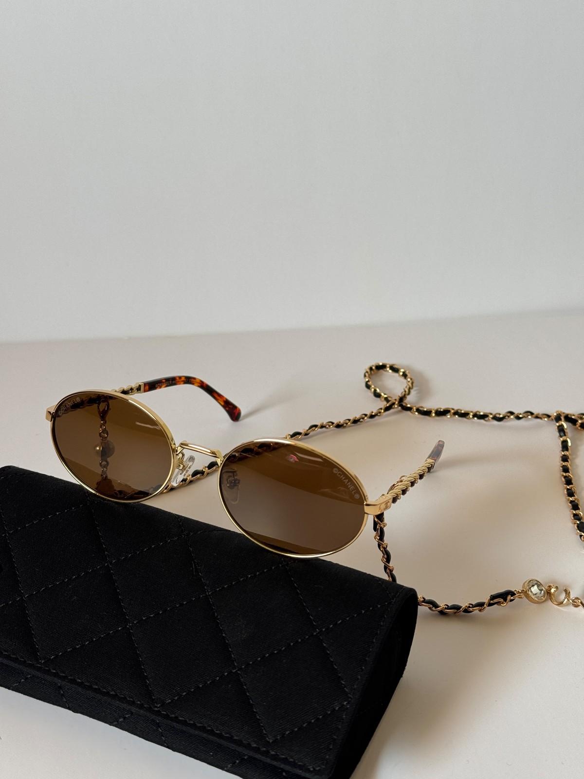 Chanel oval metal sunglasses with CC on the lens and CHANEL chain · 3